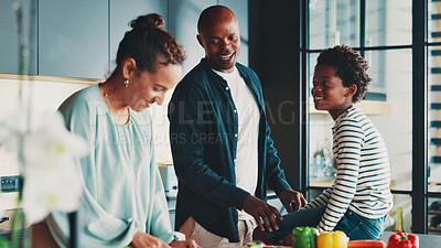 Buy stock photo Parents, boy and happy with cooking in kitchen, home and learning for diet with vegetables, bonding and support. Mother, father and child with smile, food and nutrition in African family house