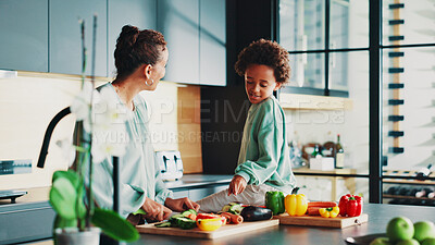 Buy stock photo Mother, boy and happy with cooking in kitchen, home and learning for diet with vegetables, bonding and support. People, mom and child with point, food and teaching with nutrition in family house