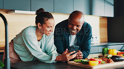 Buy stock photo Mature couple, phone and cooking in kitchen with vegetables, happy or search for recipe on web. People, man and woman with smartphone, mobile app or tutorial with video for food, diet or nutrition