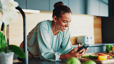 Buy stock photo Woman, phone and laugh for cooking in kitchen with vegetables, happy and search for recipe. Mature person, smartphone and meme with mobile app for tutorial video for food, diet or nutrition in home