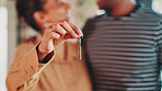 Hand, keys and couple with closeup in new home for fresh start, property or real estate investment with smile. Man, woman and happy for apartment, house and mortgage with future or financial security