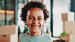 Excited, moving day and portrait of child in home with boxes smile for new house, apartment or rental. Family, real estate and African boy happy for relocation for property, investment or purchase