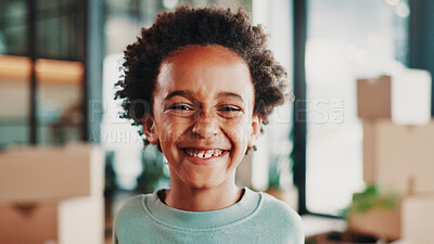 Buy stock photo Excited, moving day and portrait of child in home with boxes smile for new house, apartment or rental. Family, real estate and African boy happy for relocation for property, investment or purchase