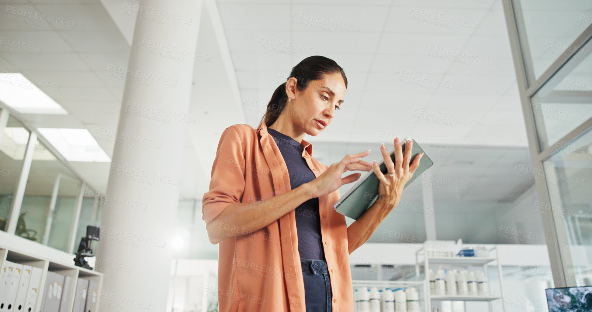 Buy stock photo Research, business and woman with tablet in office for renewable energy, power or sustainability. Low angle, planner or environmental consultant on technology for project, development or solution