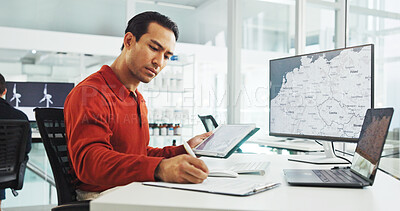 Buy stock photo Computer screen, tablet and wind turbine with man writing in office for renewable energy or sustainability. Ecology, notebook and windmill with map on display for design, development or engineering