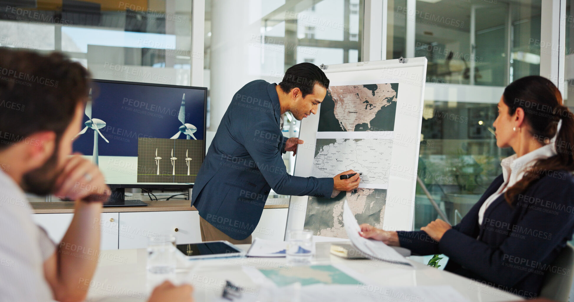 Buy stock photo Businessman, writing or meeting with whiteboard for project planning on renewable energy at office. Man, employee or team with geographic data, map or wind turbine distribution for global development