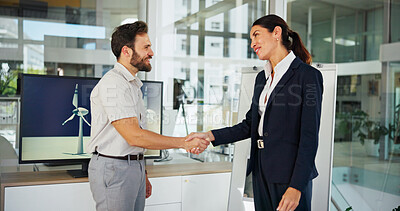 Buy stock photo Office, business people and meeting with handshake for renewable energy, project or greeting. Businessman, happy woman or colleagues shaking hands with smile for wind turbine development or deal