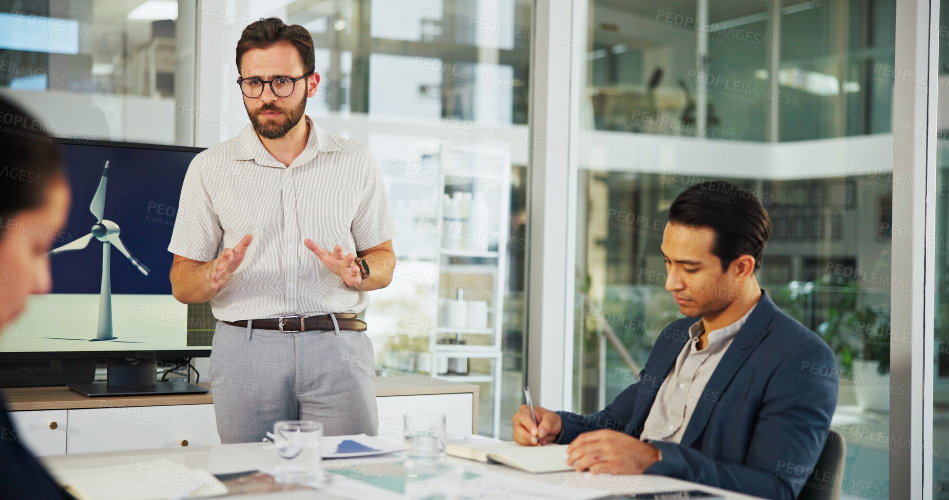 Buy stock photo Businessman, meeting or presentation with discussion for renewable or clean energy at conference. Man, employee or speaker talking to group with proposal for wind turbine or eco development at office