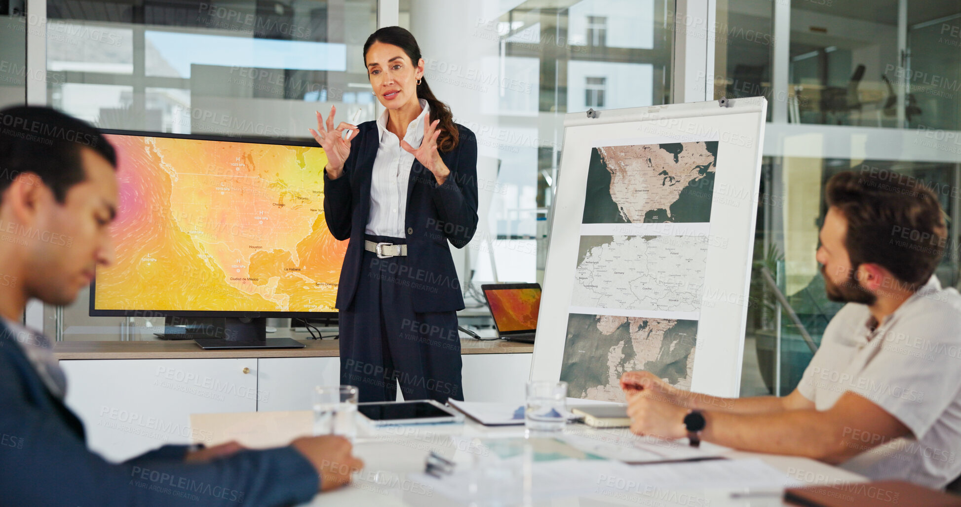 Buy stock photo Presentation, business woman and map with team for weather pattern, seasonal trends and marketing geography. Whiteboard, meeting and speaker in office with screen, climate data and global campaign