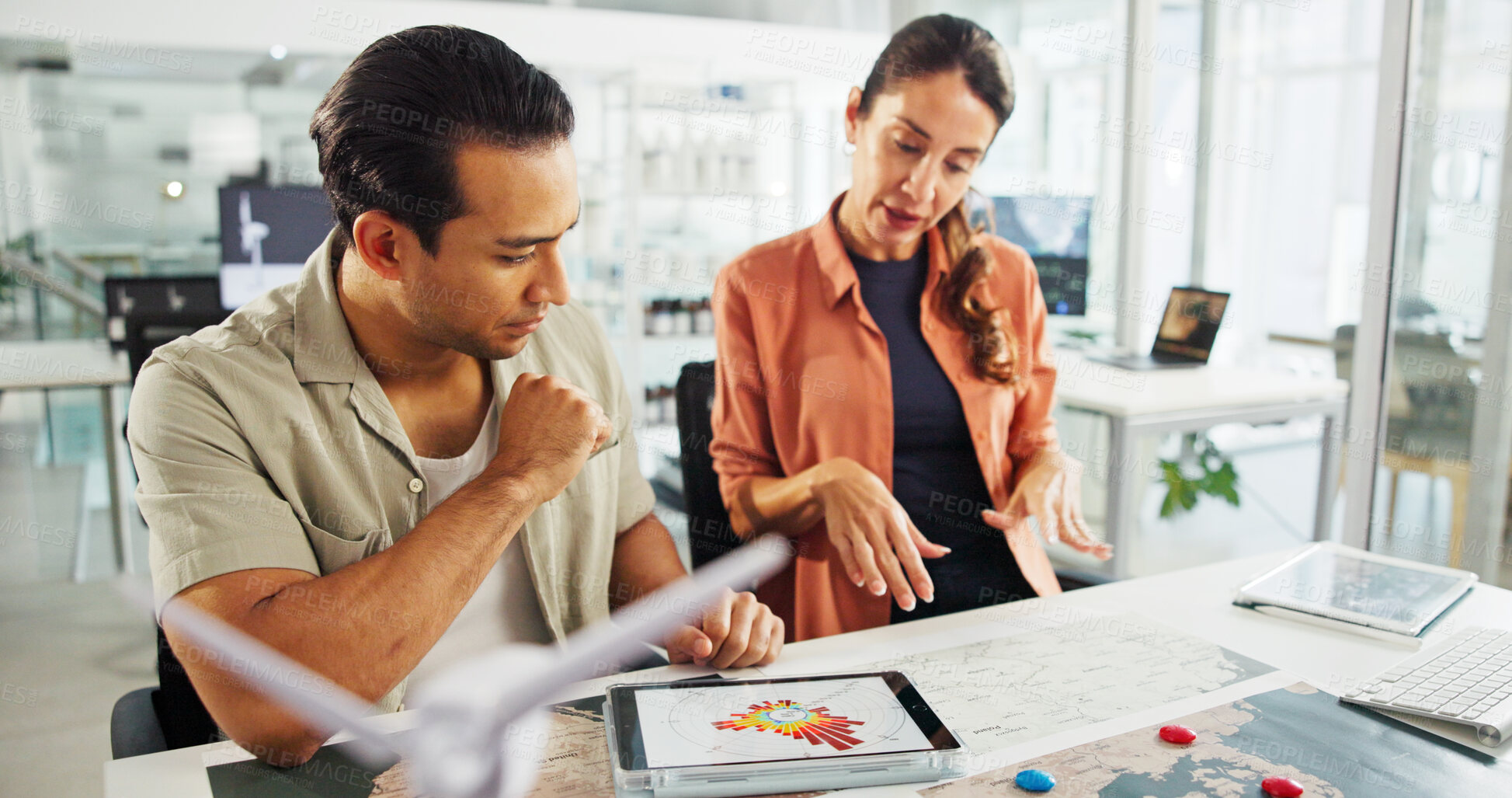 Buy stock photo Energy, tablet and people with map in office for turbine location, power grid connectivity or planning. Sustainability, engineer or team with wind diagram for speed direction, frequency or innovation