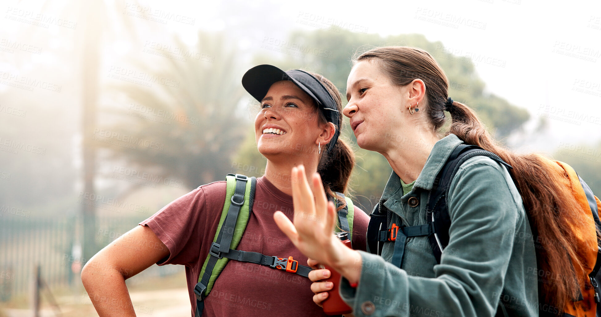 Buy stock photo Women, hiking and talk with search, direction and tourism on holiday with fitness at sunset. People, girl and friends with discussion, route and happy with sightseeing, trekking or adventure in Italy