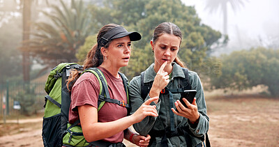 Buy stock photo Hiking, phone and women on mountain lost with navigation, direction and digital map for path. Travel, friends and people on smartphone to search location, trail and trekking on adventure in nature