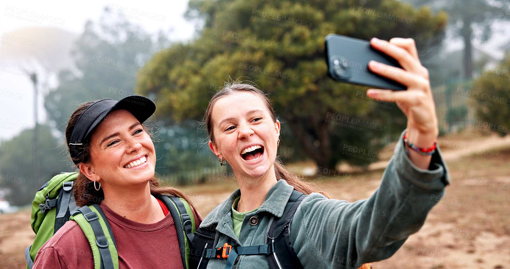 Buy stock photo Hiking, selfie and smile with friends in nature for social media post, travel and adventure. Photography, trekking and environment with women outdoor for eco tourism, backpacking and vacation