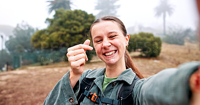 Buy stock photo Hiking, selfie and finger hearts with woman in nature for social media, travel and adventure. Photography, trekking and environment with portrait of person for eco tourism, backpacking and vacation