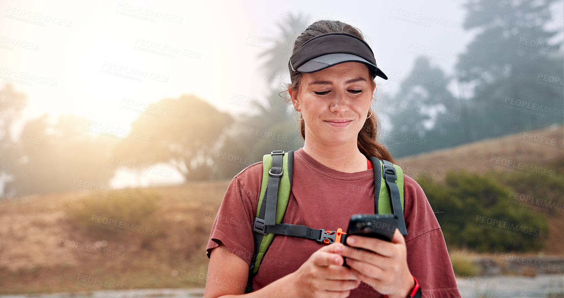 Buy stock photo Hiking, reading and phone with woman in nature for social media post, travel and adventure. Networking app, trekking and environment with person and mobile for eco tourism, backpacking and vacation