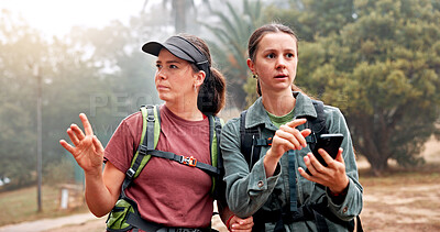 Buy stock photo Hiking, friends and women with phone to search for navigation, direction and digital map for path. Travel, mountain and people on smartphone for location, trail and trekking on adventure in nature