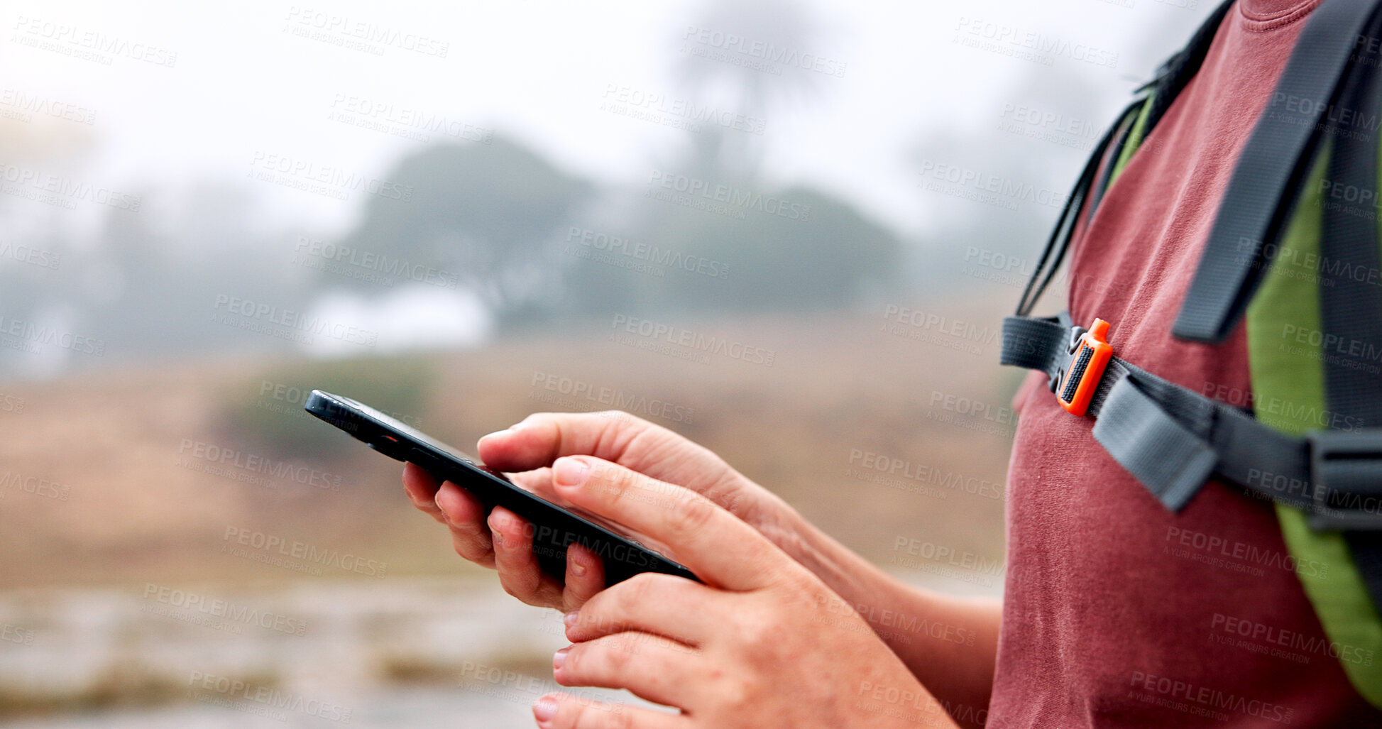 Buy stock photo Hands, phone and hiking in nature with search for direction, location and outdoor with scroll at river. Person, smartphone and click on mobile app with digital map, landmark or tourism in countryside