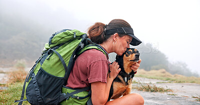 Buy stock photo Woman, kiss dog and hiking in nature by river, profile and care with bonding, rest and adventure. Person, hug and pet animal with love, outdoor and backpack by water with connection in Argentina