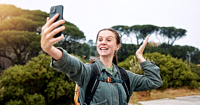Buy stock photo Hiking, video call and travel with woman in nature for streaming, smile and adventure. Virtual chat, trekking and environment with person and mobile for eco tourism, backpacking and vacation