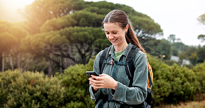 Buy stock photo Girl, hiking and phone in woods, happy and check landmark on map, trail and notification in nature. Person, woman and smartphone on mobile app with search, direction and smile on path in Argentina