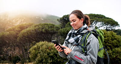 Buy stock photo Hiking, phone and scroll with woman in nature for social media post, travel and adventure. Communication app, trekking and environment with person outdoor for eco tourism, backpacking and vacation