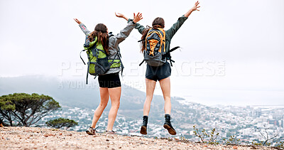 Buy stock photo Women, hiking and jump on mountain, celebration and achievement at summit with goals in nature. People, girl and friends with cheers, success and trail with back, cityscape and adventure in Italy