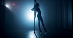 Woman, dancing and pole with party for silhouette, tease performance or sexy movement in nightclub. Theater, spotlight and female dancer in routine for seduction, stripping and stage entertainment