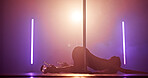 Woman, floor or dancing with pole for club, tease performance or sexy movement in night. Exotic dancer, spotlight and female person in practice routine for seduction, stripping or stage entertainment