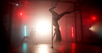 Upside down, dancer or lights with pole for show, tease performance or movement in routine. Flexible artist, agility or exotic dancing in nightclub for seduction, stripping or party entertainment