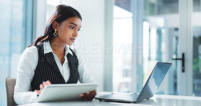 Buy stock photo Corporate, serious and woman with laptop, reading and planning for case with info on tablet or lawyer. Law firm, attorney and Indian person with tech for research, legal and review of digital records