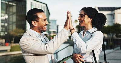 Buy stock photo Business, celebration and people high five with tablet in city for investment success, b2b deal or partnership. Finance employees, teamwork or happy with support for digital contract or collaboration