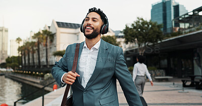 Buy stock photo Business, man and walking outdoor with headphones for morning commute, music playlist or streaming radio. Professional, person and happy in city for job opportunity, sound track and travel to work 