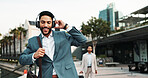 Business, man and dancing outdoor with headphones for morning commute, audio playlist and streaming radio. Professional, person and happy in city for job opportunity, celebration and travel to work