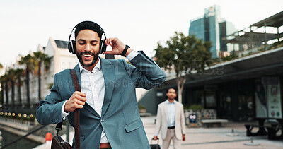 Buy stock photo Business, man and dancing outdoor with headphones for morning commute, audio playlist and streaming radio. Professional, person and happy in city for job opportunity, celebration and travel to work