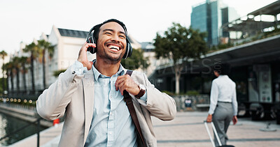 Buy stock photo Business, man and laughing outdoor with headphones for morning commute, comedy podcast or streaming radio. Professional, person and happy in city for job opportunity, sound track and walking to work