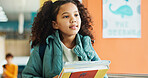 Student, girl and thinking with books, corridor and backpack for class, lesson or recess at campus or academy. Pupil, child and growth for education, development and scholarship in learning or school