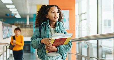 Buy stock photo Girl, child and walking with books, hallway and backpack for class, lesson or recess at campus or academy. Pupil, student and growth for education, development and scholarship in learning or school