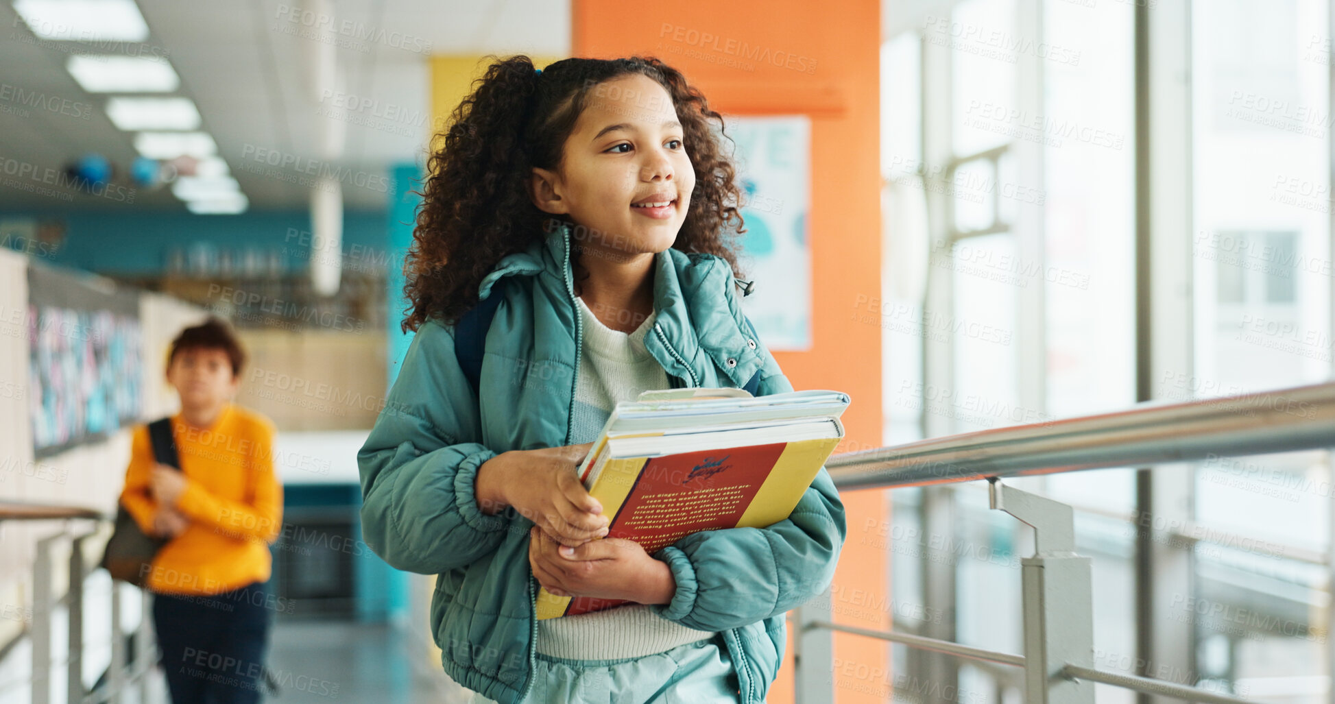 Buy stock photo Girl, child and walking with books, hallway and backpack for class, lesson or recess at campus or academy. Pupil, student and growth for education, development and scholarship in learning or school