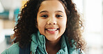 Happy girl, portrait and student with youth at elementary school for growth, education or learning. Face, child or kid with smile, backpack or knowledge for academic future or childhood development