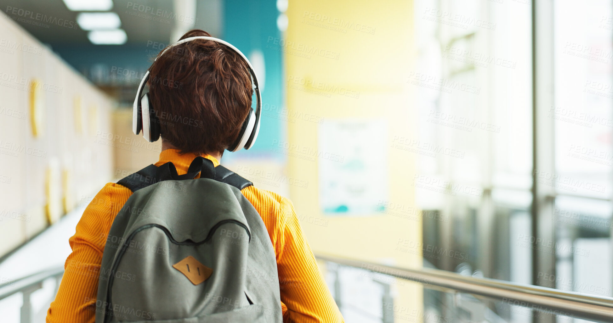Buy stock photo Headphones, walking and back of child at school with backpack for education, autism development and growth. Listening, streaming subscription and boy student at academy with music app, audio and kids
