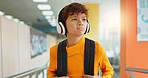 Headphones, knowledge and boy in school, student and confidence with audio, choice and radio. Learning academy, childhood and kid with headset, song and podcast with wonder, education and thoughtful