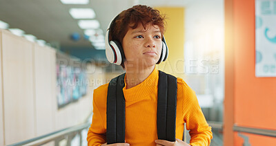Buy stock photo Headphones, knowledge and boy in school, student and confidence with audio, choice and radio. Learning academy, childhood and kid with headset, song and podcast with wonder, education and thoughtful