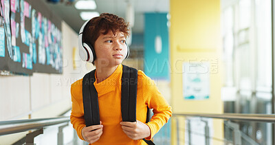 Buy stock photo Headphones, education and boy in school, student and confidence with audio, knowledge and radio. Learning academy, childhood and kid with headset, song and podcast with wonder, choice and thoughtful