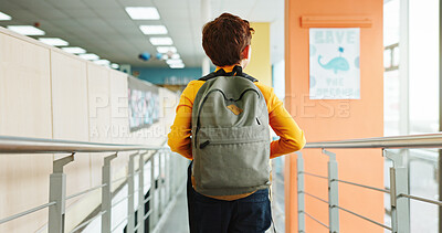 Buy stock photo School, hallway and back of boy with backpack walking for studying, classroom and learning. Students, campus and rear view of kid in corridor with bag for education, academy and knowledge in morning