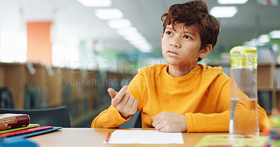Buy stock photo Boy, education and thinking with counting at library with paper, study or problem solving for development. Kid, notes and solution with learning, assessment or school project with scholarship in hall