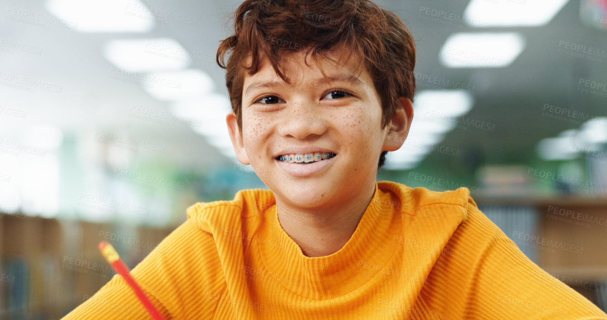 Buy stock photo Boy, happy and child with learning at library with math, study or problem solving for development. Kid, smile and portrait with education, assessment or school project with scholarship in Colombia