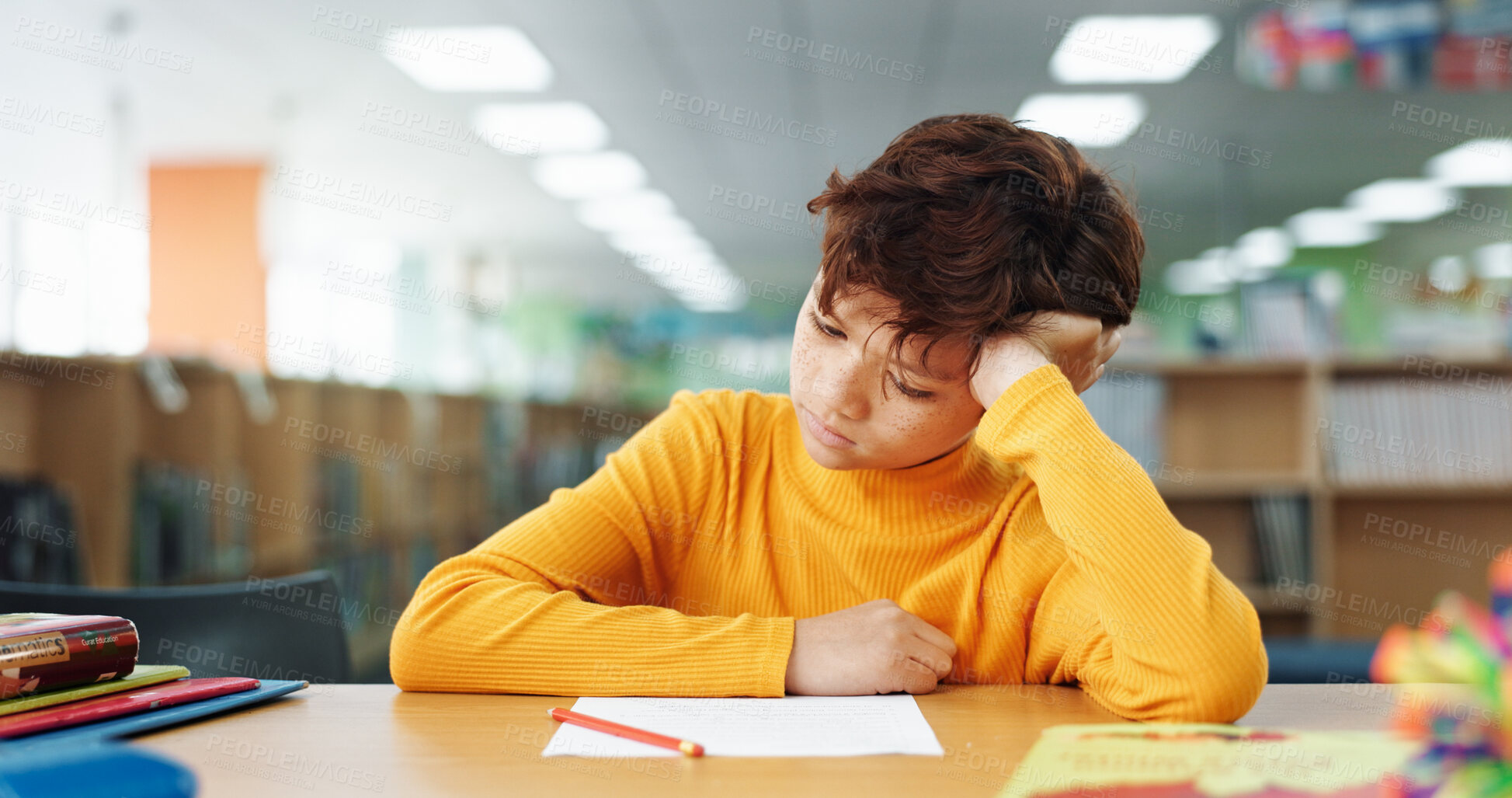 Buy stock photo Boy, education and stress with paper at library with ADHD, studying and tired with brain fog. Student, notes and kid with learning disability with assessment, school project and scholarship in hall