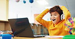 Happy boy, student or good news with laptop for elearning, winning or grade results in library. Child, kid or excited learner with wow, headphones or computer for online score or educational progress