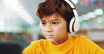 Buy stock photo Boy, child and headphones with computer at library for e learning, study and development with streaming. Kid, pc and sound with subscription for video, education and school project with scholarship