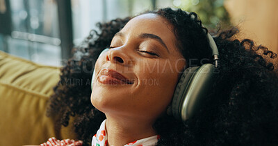 Buy stock photo Relax, music and woman with headphones on couch, streaming sound or subscription for song in home. Audio, radio or happy African person listening to album, favorite playlist or podcast in living room